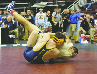 EHS senior, Louis Head, wrestles his opponent.
